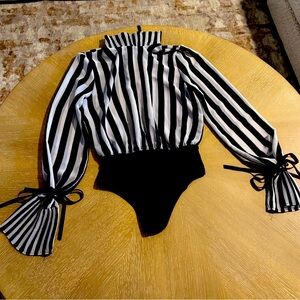 Rarely worn black and white stripped blouse 
Size L but fits more like a M